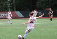 Junior midfielder Ava DeGeorge sending the ball into the box. Photo by Liliana R. Basille/The Rider News.