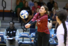 Senior libero Simone Langford making a bump. Photo courtesy of Mike Tripp.