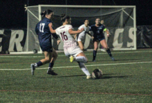 Senior forward Ava Ferrie sending the ball into the box. Photo by Liliana R. Basille