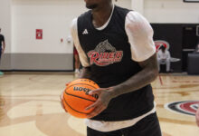 Senior forward Rich Brisco searching for the next pass. Photo by Liliana R. Basile/The Rider News