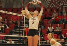 Senior setter Makenna Mason setting the ball for a hit. Photo by Liliana R. Basille/The Rider News