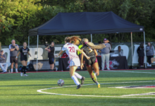 Junior midfielder Ava DeGeorge battling to the ball. Photo by Liliana R. Basille/The Rider News